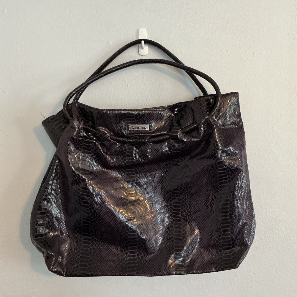 Unlisted Woman’s Glossy Purple Faux Snakeskin Tote Bag.